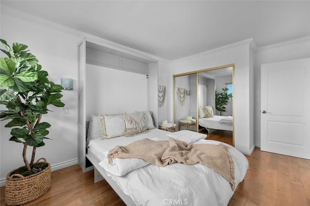 1200 Opal St Unit 7, Redondo Beach, CA 90277 - bedroom featuring wood finished floors, crown molding, and a closet