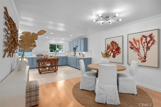 1200 Opal St Unit 7, Redondo Beach, CA 90277 - dining area featuring crown molding, a chandelier, light wood-style flooring, and recessed lighting