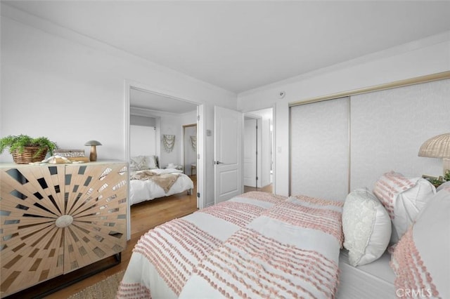 1200 Opal St Unit 7, Redondo Beach, CA 90277 - bedroom with wood finished floors, a closet, and ornamental molding