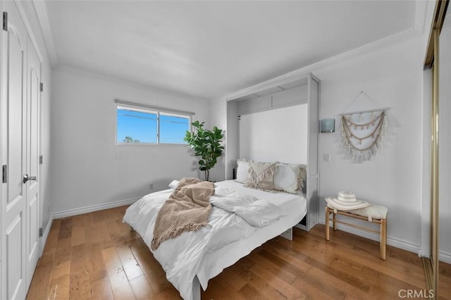 1200 Opal St Unit 7, Redondo Beach, CA 90277 - bedroom with hardwood / wood-style flooring and crown molding