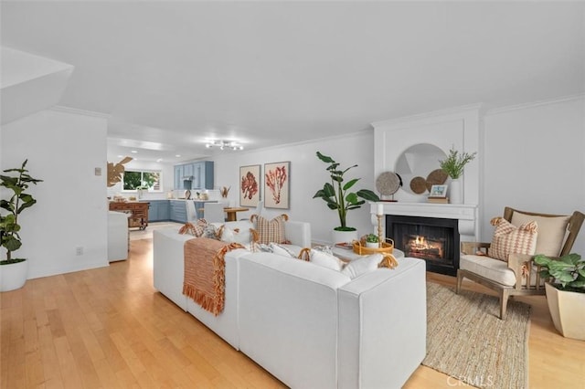 1200 Opal St Unit 7, Redondo Beach, CA 90277 - living area featuring light wood-style floors, a lit fireplace, and ornamental molding