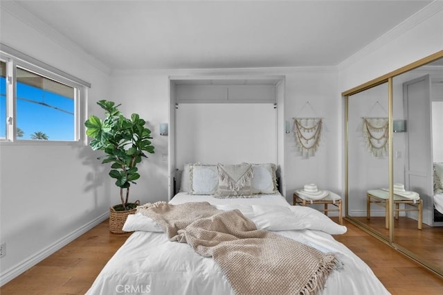 1200 Opal St Unit 7, Redondo Beach, CA 90277 - bedroom featuring wood finished floors, a closet, and ornamental molding