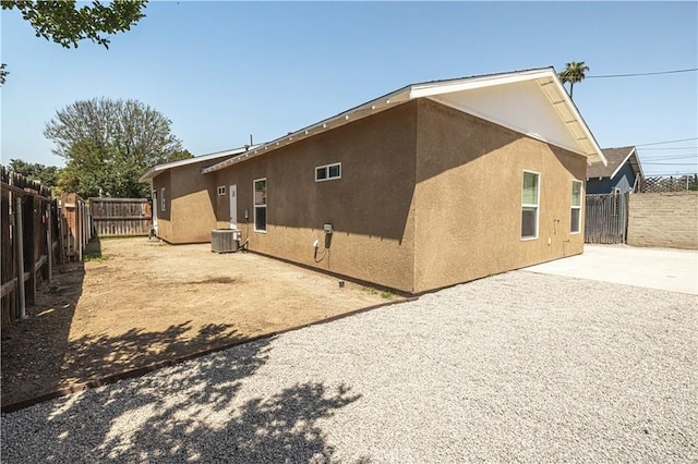 4158 Larchwood Pl, Riverside, CA 92506 - view of side of property with stucco siding, a fenced backyard, and a patio area