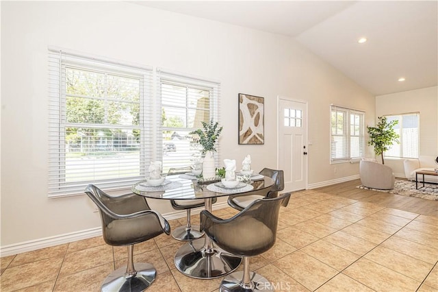4158 Larchwood Pl, Riverside, CA 92506 - dining area with lofted ceiling, healthy amount of natural light, light tile patterned flooring, and recessed lighting