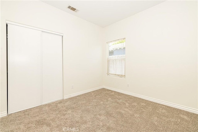 4158 Larchwood Pl, Riverside, CA 92506 - unfurnished bedroom featuring carpet and a closet