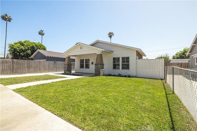 4158 Larchwood Pl, Riverside, CA 92506 - rear view of house with a fenced backyard and stone siding
