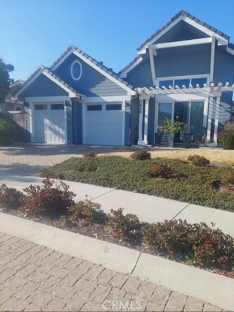 1626 Monterey Ave, Grover Beach, CA 93433 - ranch-style home featuring a garage, driveway, and a tiled roof