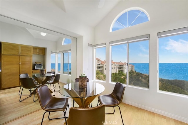 46 Saint Tropez, Laguna Niguel, CA 92677 - dining room featuring light wood-style floors, a water view, and high vaulted ceiling