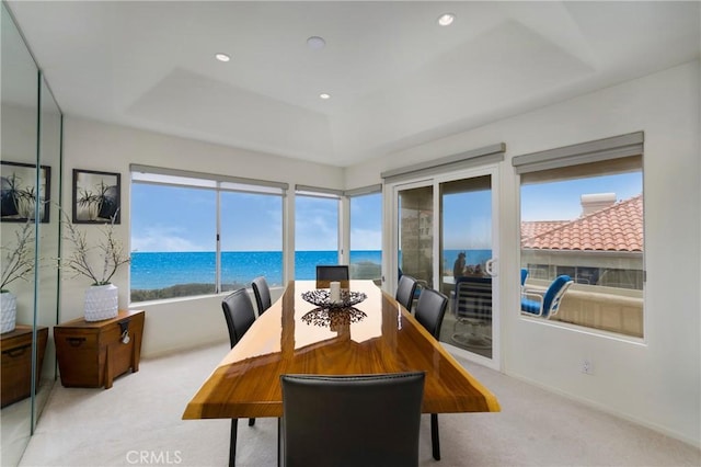 46 Saint Tropez, Laguna Niguel, CA 92677 - carpeted dining room with a raised ceiling, a water view, and recessed lighting