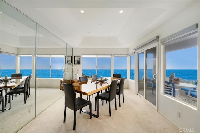 46 Saint Tropez, Laguna Niguel, CA 92677 - carpeted dining area with a water view, a raised ceiling, recessed lighting, and healthy amount of natural light