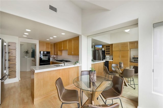 46 Saint Tropez, Laguna Niguel, CA 92677 - dining room with light wood-style floors and recessed lighting