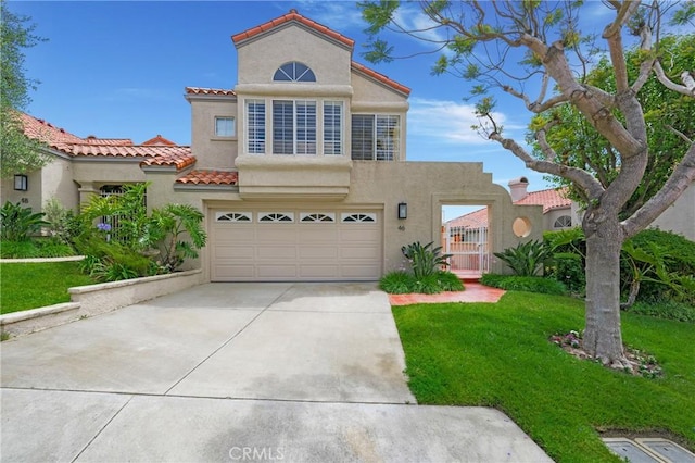 46 Saint Tropez, Laguna Niguel, CA 92677 - mediterranean / spanish home with stucco siding, driveway, a garage, a tiled roof, and a front lawn