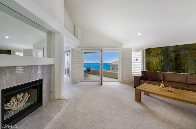 46 Saint Tropez, Laguna Niguel, CA 92677 - living room with a premium fireplace, vaulted ceiling, recessed lighting, and carpet floors