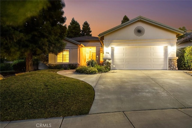 1044 Sleepy Hollow Rd, Paso Robles, CA 93446 - single story home featuring concrete driveway, a garage, stucco siding, and a yard