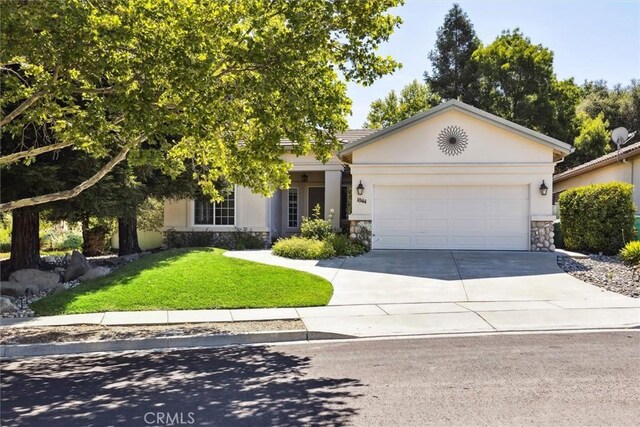 1044 Sleepy Hollow Rd, Paso Robles, CA 93446 - view of front of house with stone siding, driveway, an attached garage, a front lawn, and stucco siding