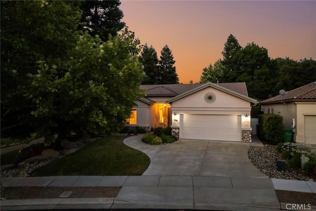 1044 Sleepy Hollow Rd, Paso Robles, CA 93446 - view of front of property with driveway, a garage, stucco siding, and stone siding