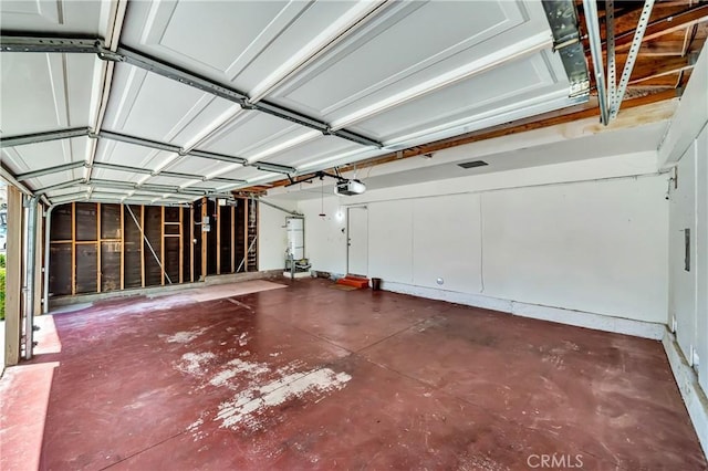 3115 Crowne Dr, Palmdale, CA 93551 - garage featuring secured water heater and a garage door opener