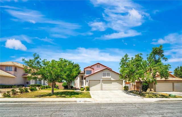 3115 Crowne Dr, Palmdale, CA 93551 - view of front of home featuring concrete driveway, an attached garage, stucco siding, a front yard, and a residential view