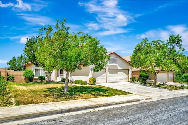 3115 Crowne Dr, Palmdale, CA 93551 - view of property hidden behind natural elements featuring a garage, driveway, and stucco siding