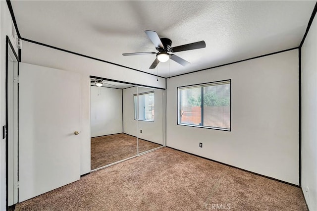 3115 Crowne Dr, Palmdale, CA 93551 - unfurnished bedroom featuring carpet, a closet, and ceiling fan