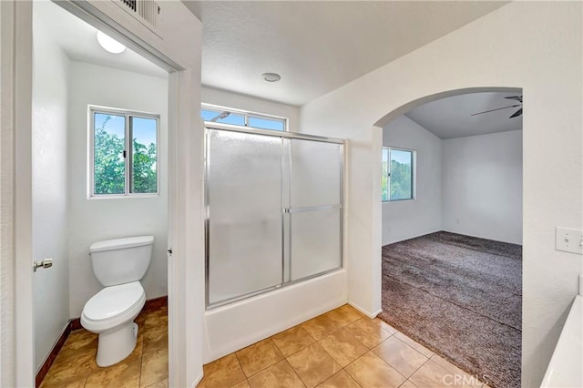 3115 Crowne Dr, Palmdale, CA 93551 - full bathroom featuring plenty of natural light, shower / bath combination with glass door, tile patterned floors, and ceiling fan