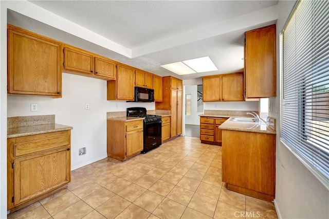 3115 Crowne Dr, Palmdale, CA 93551 - kitchen featuring black appliances, brown cabinets, light tile patterned flooring, and light countertops