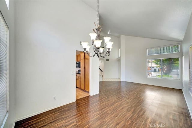 3115 Crowne Dr, Palmdale, CA 93551 - spare room with high vaulted ceiling, a chandelier, and wood finished floors