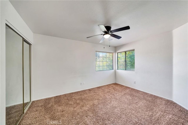 3115 Crowne Dr, Palmdale, CA 93551 - unfurnished bedroom with carpet, a closet, and ceiling fan