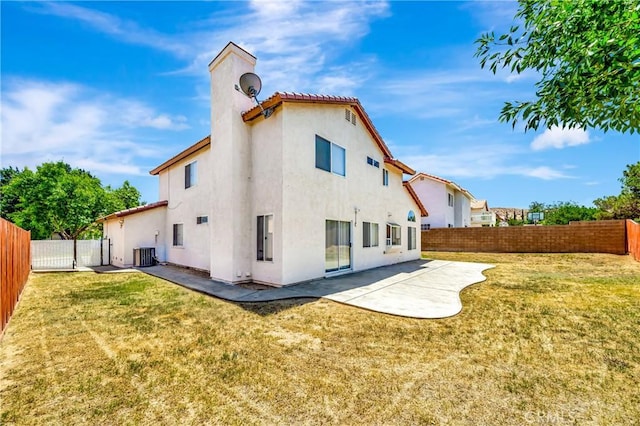 3115 Crowne Dr, Palmdale, CA 93551 - rear view of property featuring stucco siding, a patio, a fenced backyard, and a tile roof