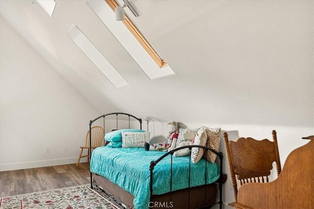 21658 W Buckthorne Dr, Cedarpines Park, CA 92322 - bedroom featuring a skylight, vaulted ceiling, and wood finished floors