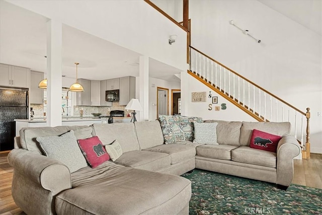 21658 W Buckthorne Dr, Cedarpines Park, CA 92322 - living area featuring light wood finished floors and stairs