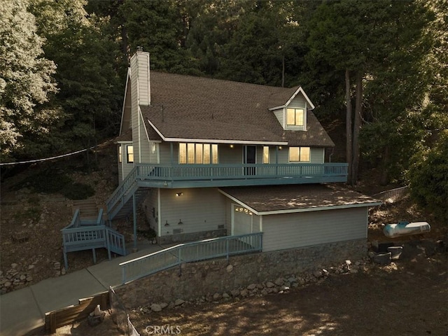 21658 W Buckthorne Dr, Cedarpines Park, CA 92322 - rear view of house with a chimney, stairway, and a view of trees