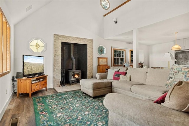 21658 W Buckthorne Dr, Cedarpines Park, CA 92322 - living area featuring wood finished floors, a wood stove, and high vaulted ceiling