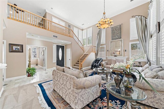15075 Avenida Del Monte, Chino Hills, CA 91709 - living room with a towering ceiling, stairs, plenty of natural light, a chandelier, and ornamental molding