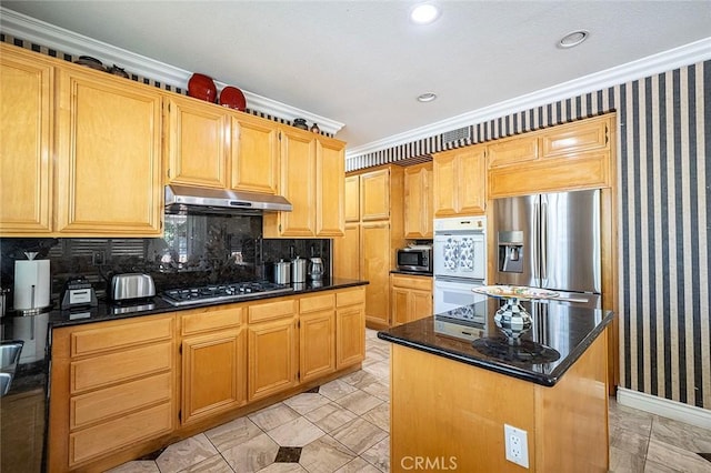 15075 Avenida Del Monte, Chino Hills, CA 91709 - kitchen with appliances with stainless steel finishes, under cabinet range hood, crown molding, dark stone counters, and tasteful backsplash