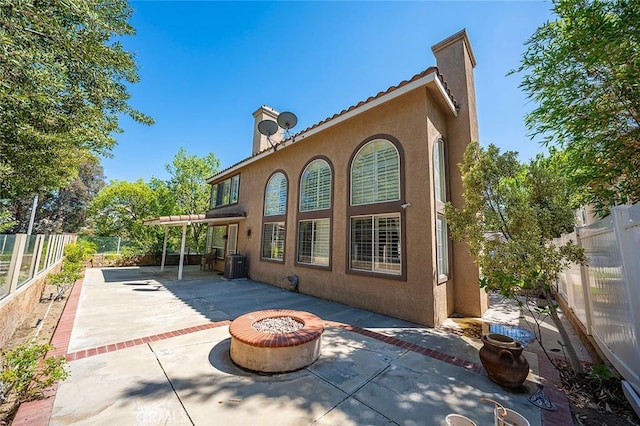 15075 Avenida Del Monte, Chino Hills, CA 91709 - back of house with a fire pit, stucco siding, a chimney, a patio area, and a fenced backyard
