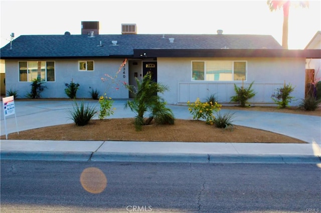 43340 Illinois, Palm Desert, CA 92211 - ranch-style home with stucco siding, curved driveway, and a shingled roof