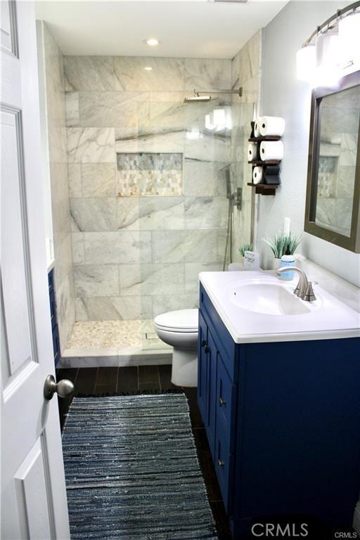 43340 Illinois, Palm Desert, CA 92211 - full bathroom with vanity, a tile shower, tile patterned floors, and recessed lighting