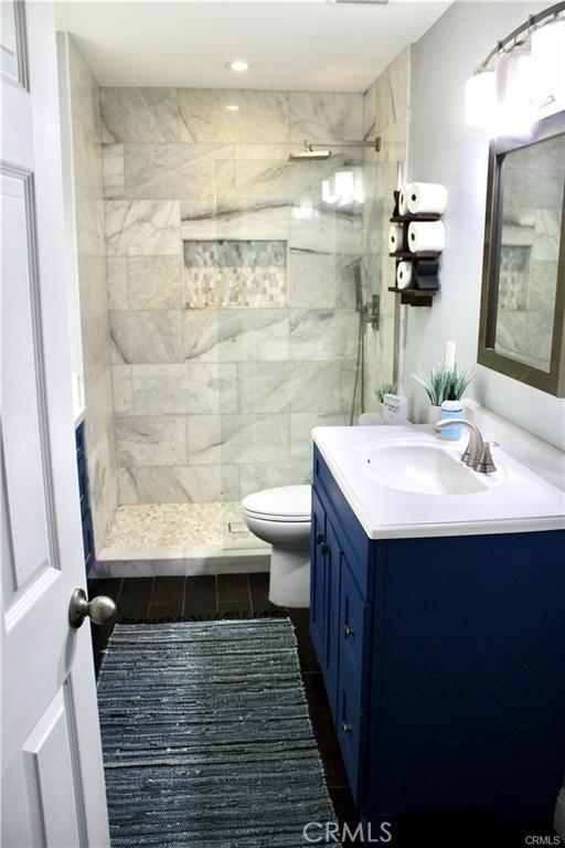 43340 Illinois, Palm Desert, CA 92211 - full bath featuring vanity, a tile shower, tile patterned floors, and recessed lighting