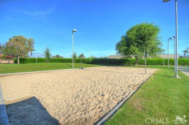 43340 Illinois, Palm Desert, CA 92211 - view of property's community featuring a lawn and volleyball court