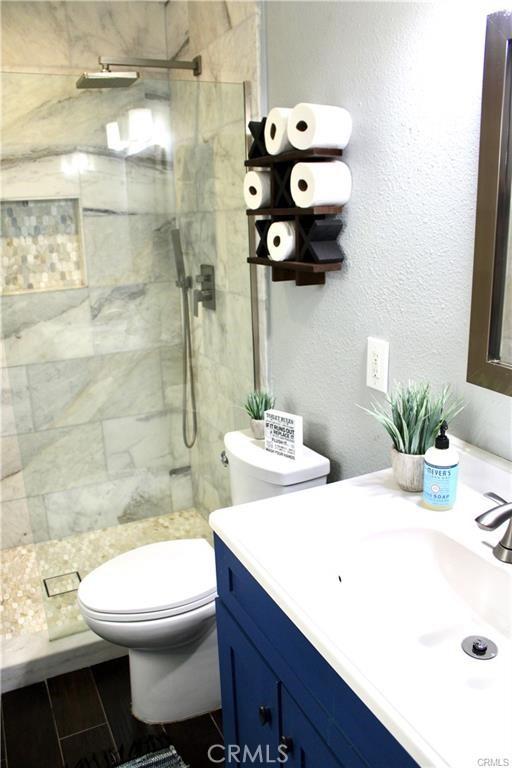 43340 Illinois, Palm Desert, CA 92211 - bathroom featuring vanity and a tile shower