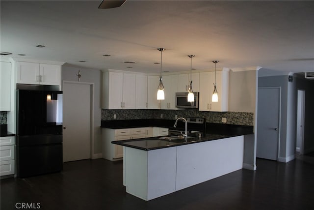 43340 Illinois, Palm Desert, CA 92211 - kitchen with freestanding refrigerator, stainless steel microwave, dark countertops, a peninsula, and recessed lighting