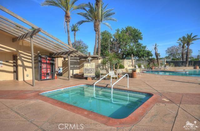 43340 Illinois, Palm Desert, CA 92211 - community pool with a pergola and a patio