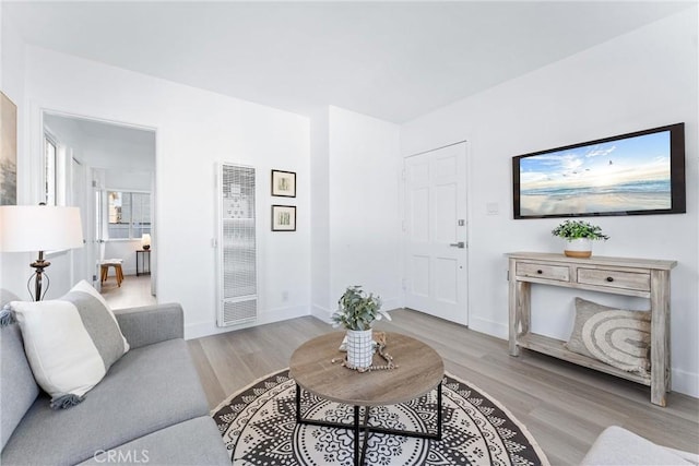 765 Loma Ave Unit 769, Long Beach, CA 90804 - living area with a heating unit and light wood-type flooring