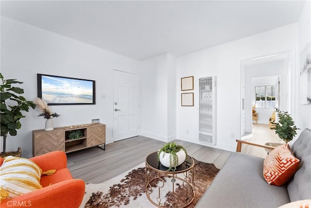 765 Loma Ave Unit 769, Long Beach, CA 90804 - living room with a heating unit and wood finished floors