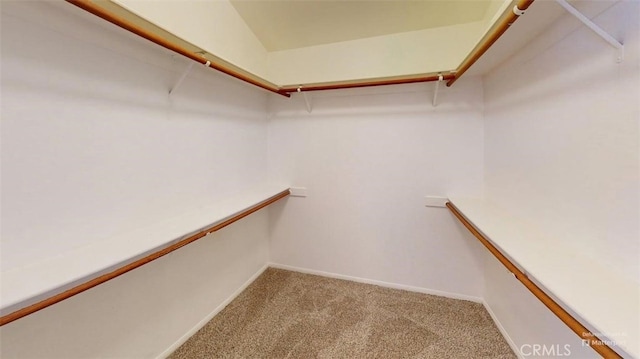 12429 Pocono Pl, Apple Valley, CA 92308 - walk in closet featuring light carpet