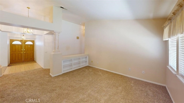 12429 Pocono Pl, Apple Valley, CA 92308 - carpeted empty room with a chandelier and baseboards
