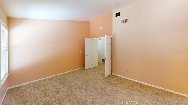 12429 Pocono Pl, Apple Valley, CA 92308 - spare room featuring light carpet and baseboards