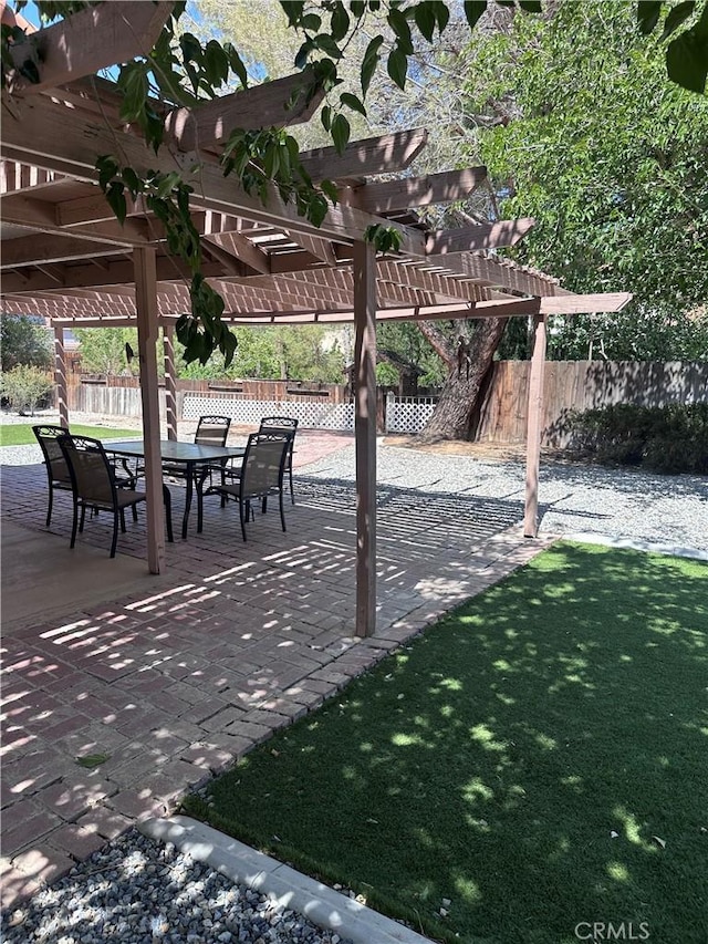 12429 Pocono Pl, Apple Valley, CA 92308 - view of patio / terrace featuring a pergola and outdoor dining space