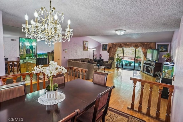 17149 Gledhill St, Northridge, CA 91325 - dining space with a textured ceiling, wood finished floors, and a chandelier